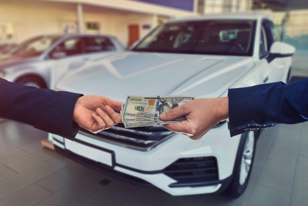 Money exchanging hands for a vehicle