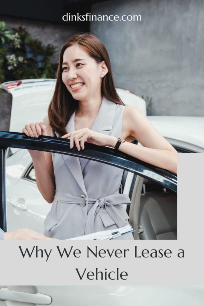 Young Woman standing in the door of a car
