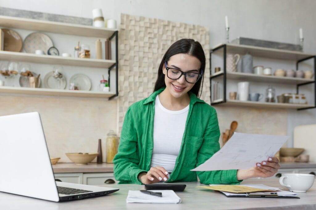 Woman in glasses balancing her budget