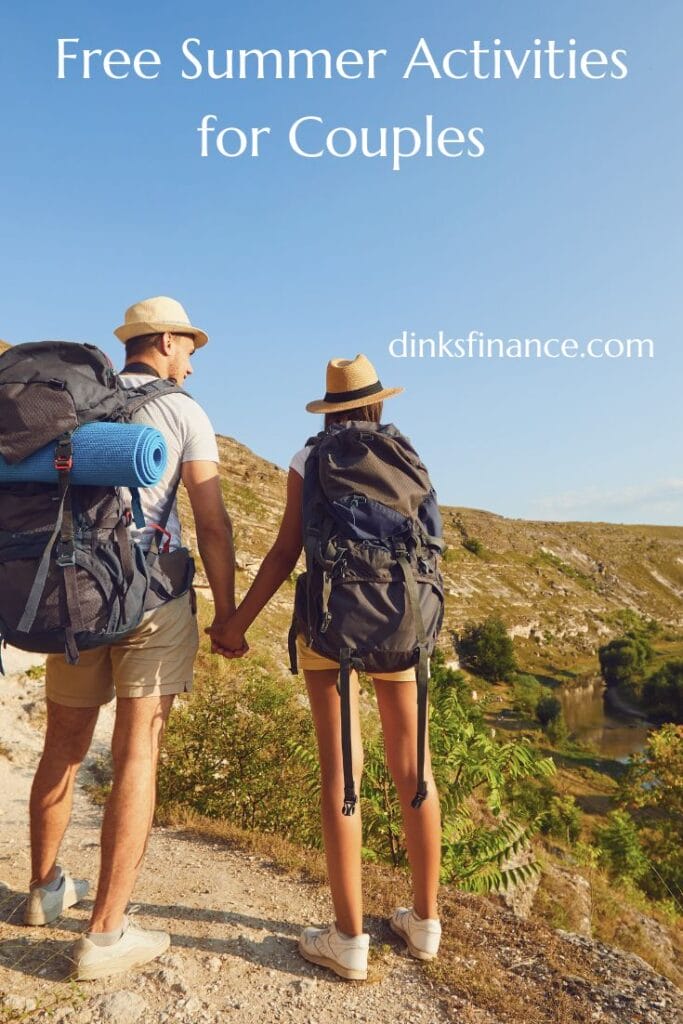Couple holding hands and wearing hiking gear.