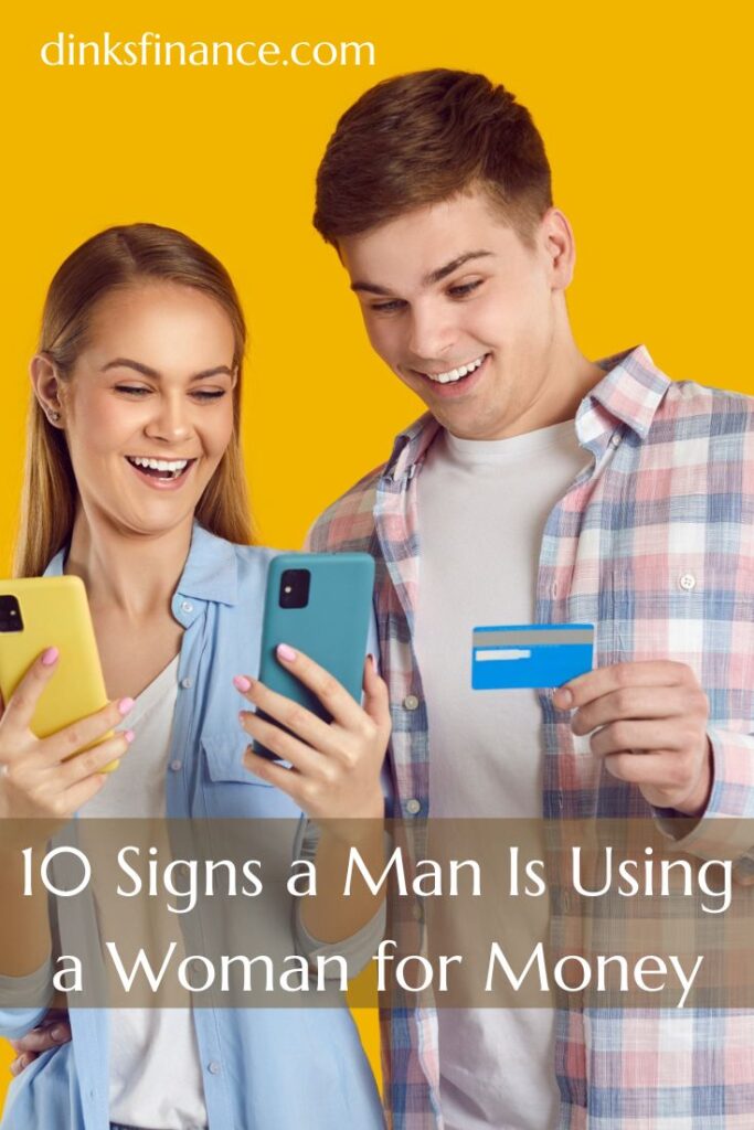 Woman Standing with a Man Who Is Holding a Credit Card and Smiling