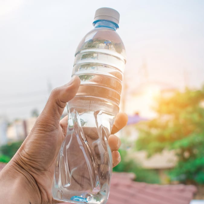 holding bottled water